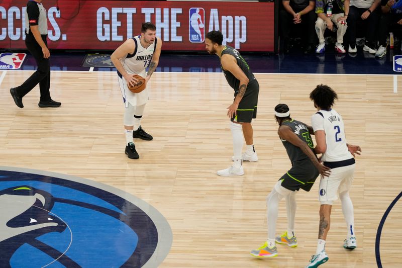 MINNEAPOLIS, MN - MAY 30: Luka Doncic #77 of the Dallas Mavericks dribbles the ball during the game against the Minnesota Timberwolves during Game 5 of the Western Conference Finals of the 2024 NBA Playoffs on May 30, 2024 at Target Center in Minneapolis, Minnesota. NOTE TO USER: User expressly acknowledges and agrees that, by downloading and or using this Photograph, user is consenting to the terms and conditions of the Getty Images License Agreement. Mandatory Copyright Notice: Copyright 2024 NBAE (Photo by Jordan Johnson/NBAE via Getty Images)