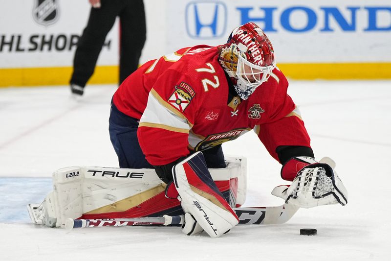 Jan 11, 2024; Sunrise, Florida, USA; Florida Panthers goaltender Sergei Bobrovsky (72) covers the puck against the Los Angeles Kings during the first period at Amerant Bank Arena. Mandatory Credit: Jasen Vinlove-USA TODAY Sports