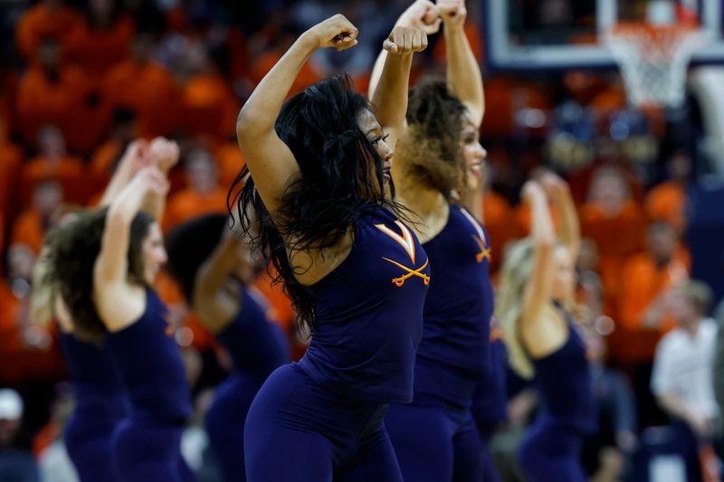 Jan 24, 2024; Charlottesville, Virginia, USA; Members of the Virginia Cavaliers Dance Team dance during a timeout against the North Carolina State Wolfpack in the second half at John Paul Jones Arena. Mandatory Credit: Geoff Burke-USA TODAY Sports