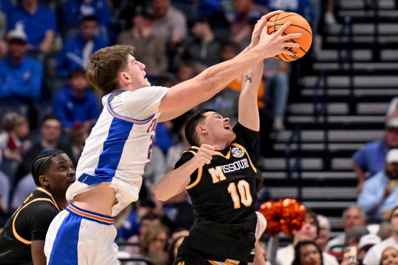 Mar 14, 2025; Nashville, TN, USA;  Florida Gators forward Alex Condon (21) grabs the ball from Missouri Tigers guard Jeremy Sanchez (10) during the second half at Bridgestone Arena. Mandatory Credit: Steve Roberts-Imagn Images