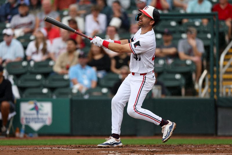 Mar 6, 2024; Fort Myers, Florida, USA;  Minnesota Twins second baseman Edouard Julien (47) hits a three-run home run against the Boston Red Sox in the third inning at Hammond Stadium. Mandatory Credit: Nathan Ray Seebeck-USA TODAY Sports