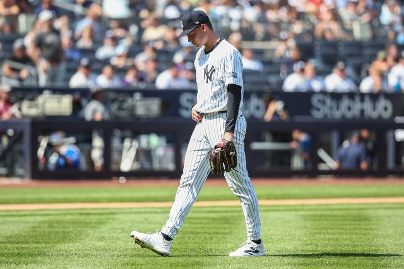 Aug 24, 2024; Bronx, New York, USA;  New York Yankees starting pitcher Will Warren (98) walks off the mound in the third inning against the Colorado Rockies at Yankee Stadium. Mandatory Credit: Wendell Cruz-USA TODAY Sports