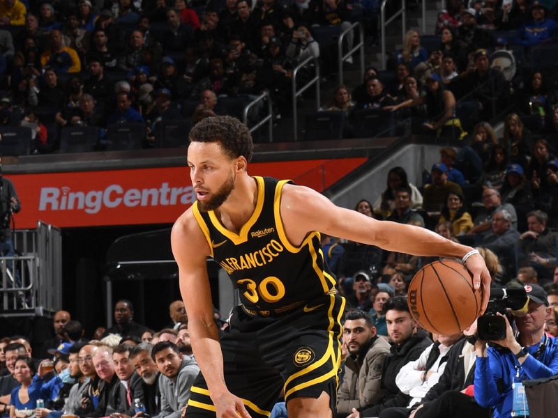 SAN FRANCISCO, CA - JANUARY 10:  Stephen Curry #30 of the Golden State Warriors handles the ball during the game  on January 10, 2024 at Chase Center in San Francisco, California. NOTE TO USER: User expressly acknowledges and agrees that, by downloading and or using this photograph, user is consenting to the terms and conditions of Getty Images License Agreement. Mandatory Copyright Notice: Copyright 2024 NBAE (Photo by Noah Graham/NBAE via Getty Images)