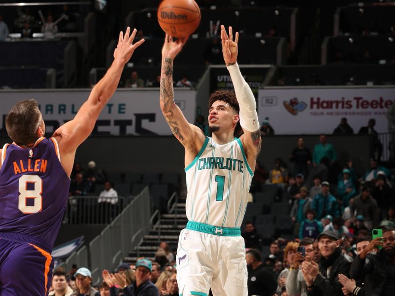 CHARLOTTE, NC - JANUARY 7: LaMelo Ball #1 of the Charlotte Hornets shoots a three point basket during the game against the Phoenix Suns on January 7, 2025 at Spectrum Center in Charlotte, North Carolina. NOTE TO USER: User expressly acknowledges and agrees that, by downloading and or using this photograph, User is consenting to the terms and conditions of the Getty Images License Agreement. Mandatory Copyright Notice: Copyright 2025 NBAE (Photo by Kent Smith/NBAE via Getty Images)