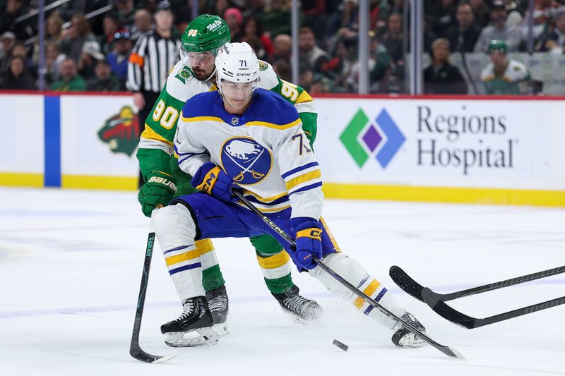 Nov 29, 2025; Saint Paul, Minnesota, USA; Buffalo Sabres center Ryan McLeod (71) skates with the puck as Minnesota Wild left wing Marcus Johansson (90) defends during the second period at Grand Casino Arena. Mandatory Credit: Matt Krohn-Imagn Images