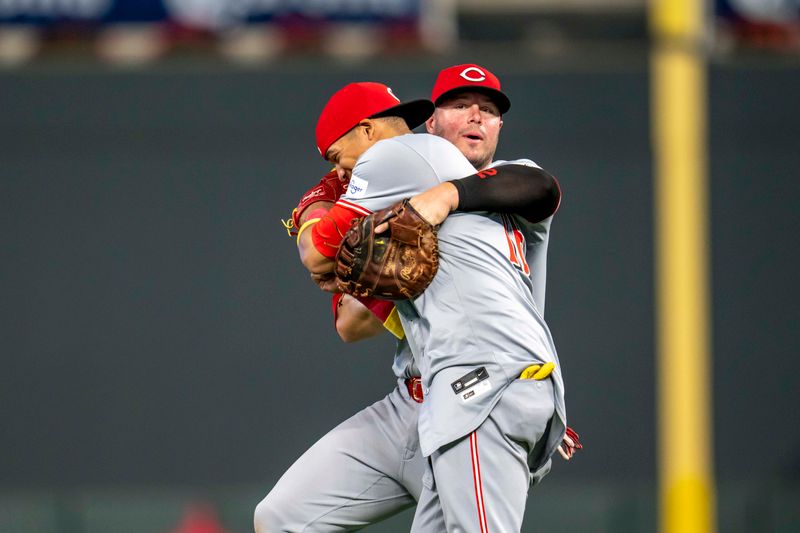 Sep 13, 2024; Minneapolis, Minnesota, USA; Cincinnati Reds third baseman Noelvi Marte (16) and first baseman Ty France (2) celebrate after defeating the Minnesota Twins at Target Field. Mandatory Credit: Jesse Johnson-Imagn Images