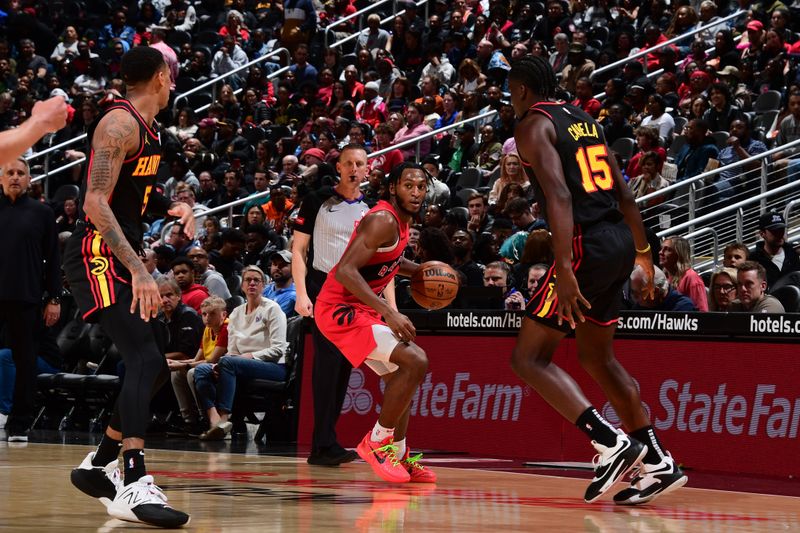 ATLANTA, GA - February 23: Immanuel Quickley #5 of the Toronto Raptors handles the ball during the game against the Atlanta Hawks on February 23, 2024 at State Farm Arena in Atlanta, Georgia.  NOTE TO USER: User expressly acknowledges and agrees that, by downloading and/or using this Photograph, user is consenting to the terms and conditions of the Getty Images License Agreement. Mandatory Copyright Notice: Copyright 2024 NBAE (Photo by Scott Cunningham/NBAE via Getty Images)