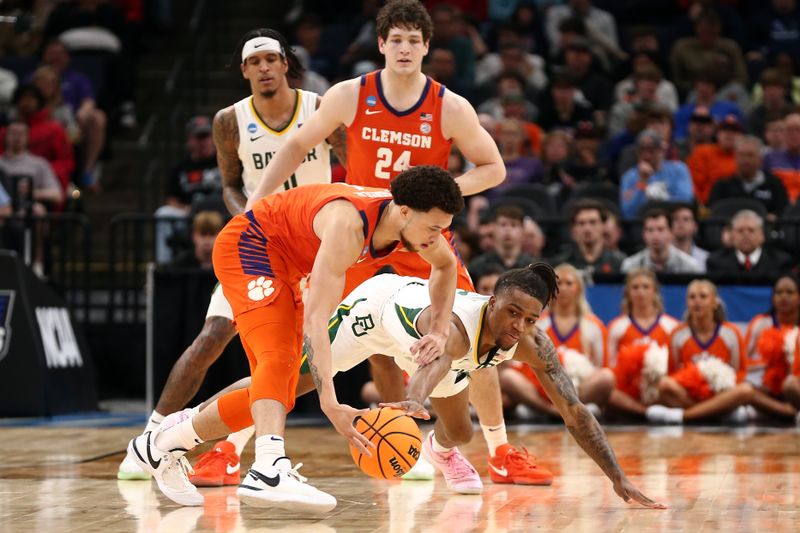 Mar 24, 2024; Memphis, TN, USA; Baylor Bears guard Jayden Nunn (2) battles for the ball against Clemson Tigers guard Chase Hunter (1) in the second half in the second round of the 2024 NCAA Tournament at FedExForum. Mandatory Credit: Petre Thomas-USA TODAY Sports