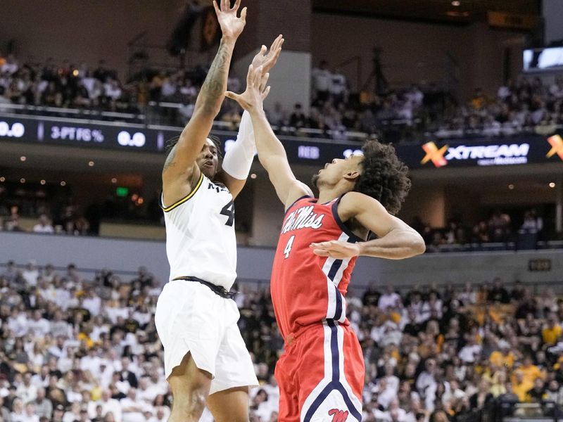 Mar 4, 2023; Columbia, Missouri, USA; Missouri Tigers guard DeAndre Gholston (4) shoots over Mississippi Rebels forward Jaemyn Brakefield (4) during the first half at Mizzou Arena. Mandatory Credit: Denny Medley-USA TODAY Sports