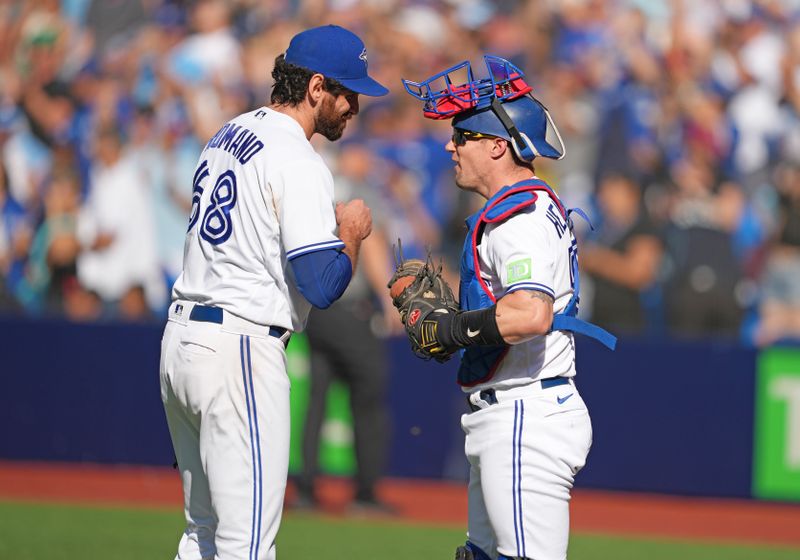 Sep 10, 2023; Toronto, Ontario, CAN; Toronto Blue Jays relief pitcher Jordan Romano (68) and catcher Tyler Heineman (55) celebrate the win against the Kansas City Royals at the end of the ninth inning at Rogers Centre. Mandatory Credit: Nick Turchiaro-USA TODAY Sports