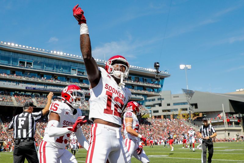 Sep 23, 2023; Cincinnati, Ohio, USA; Oklahoma Sooners defensive back Key Lawrence (12) reacts after intercepting the ball during the first half against the Cincinnati Bearcats at Nippert Stadium. Mandatory Credit: Katie Stratman-USA TODAY Sports