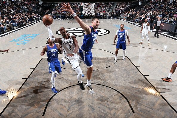 BROOKLYN, NY - NOVEMBER 8: Lonnie Walker IV #8 of the Brooklyn Nets shoots the ball during the game against the LA Clippers on November 8, 2023 at Barclays Center in Brooklyn, New York. NOTE TO USER: User expressly acknowledges and agrees that, by downloading and or using this Photograph, user is consenting to the terms and conditions of the Getty Images License Agreement. Mandatory Copyright Notice: Copyright 2023 NBAE (Photo by Stephen Gosling/NBAE via Getty Images)