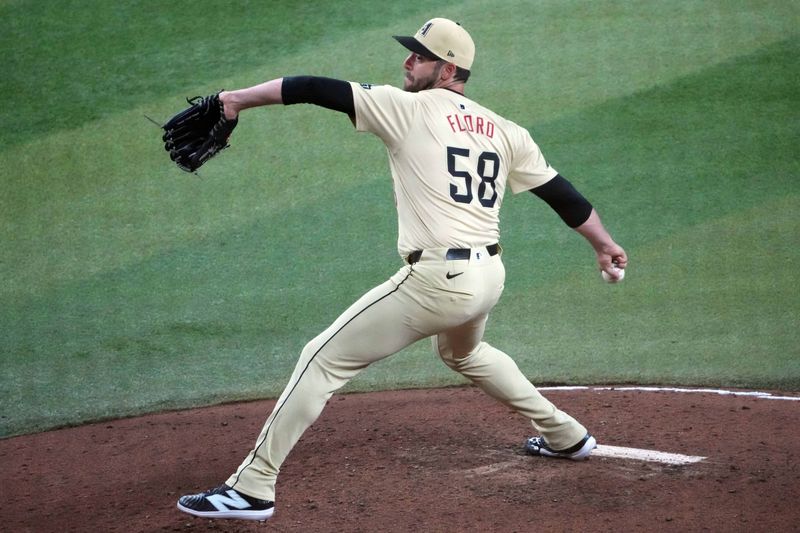 Aug 13, 2024; Phoenix, Arizona, USA; Arizona Diamondbacks pitcher Dylan Floro (58) pitches against the Arizona Diamondbacks during the sixth inning at Chase Field. Mandatory Credit: Joe Camporeale-USA TODAY Sports