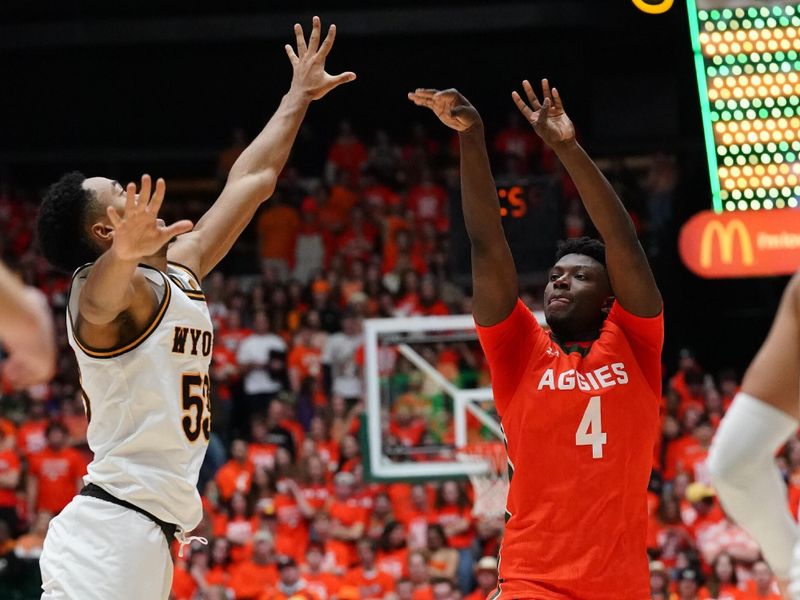 Feb 24, 2023; Fort Collins, Colorado, USA; Colorado State Rams guard Isaiah Stevens (4) shoots a three point basket against Wyoming Cowboys guard Xavier DuSell (53) in the second half. at Moby Arena. Colorado State defeated the Wyoming Cowboys 84-71. Mandatory Credit: Michael Madrid-USA TODAY Sports