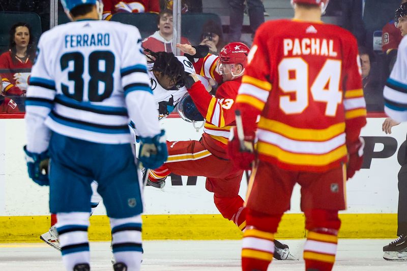 Apr 18, 2024; Calgary, Alberta, CAN; San Jose Sharks right wing Givani Smith (54) and Calgary Flames right wing Adam Klapka (43) fights during the second period at Scotiabank Saddledome. Mandatory Credit: Sergei Belski-USA TODAY Sports