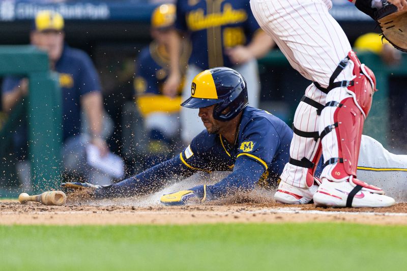 Jun 4, 2024; Philadelphia, Pennsylvania, USA; Milwaukee Brewers outfielder Blake Perkins (16) scores past Philadelphia Phillies catcher J.T. Realmuto (10) during the third inning at Citizens Bank Park. Mandatory Credit: Bill Streicher-USA TODAY Sports