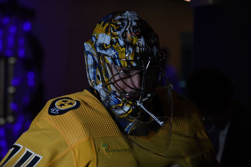 Dec 2, 2023; Nashville, Tennessee, USA; Nashville Predators goaltender Juuse Saros (74) walks to the ice for warmups before a game against the New York Rangers at Bridgestone Arena. Mandatory Credit: Christopher Hanewinckel-USA TODAY Sports