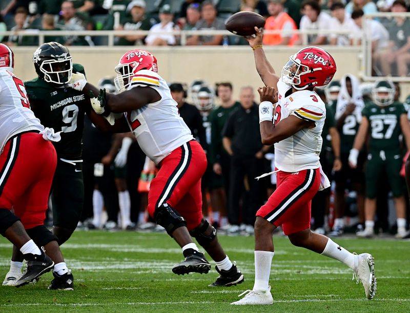 Sep 23, 2023; East Lansing, Michigan, USA;  Maryland Terrapins quarterback Taulia Tagovailoa (3) throws downfield against the Michigan State Spartans in the fourth quarter at Spartan Stadium. Mandatory Credit: Dale Young-USA TODAY Sports