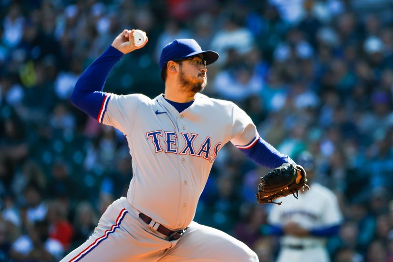 Oct 1, 2023; Seattle, Washington, USA; Texas Rangers starting pitcher Dane Dunning (33) throws against the Seattle Mariners during the first inning at T-Mobile Park. Mandatory Credit: Joe Nicholson-USA TODAY Sports