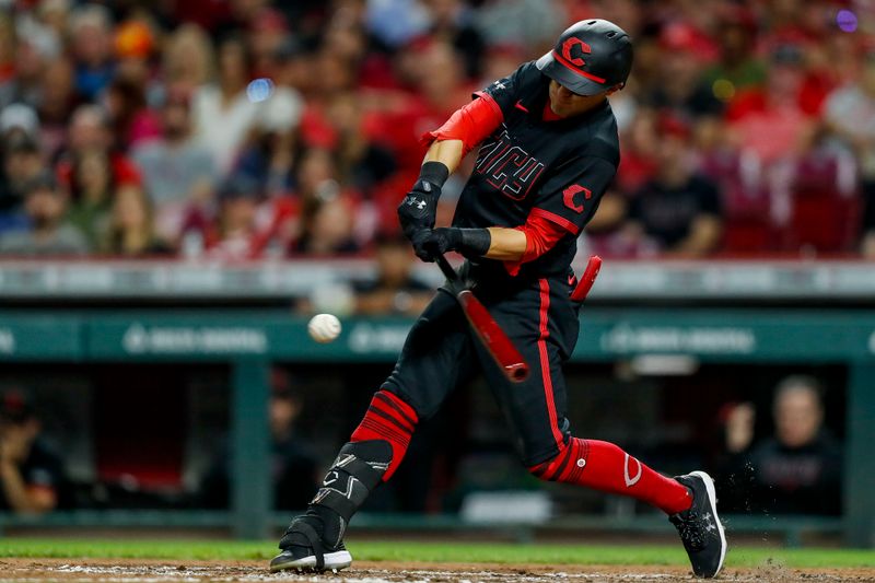 Sep 22, 2023; Cincinnati, Ohio, USA; Cincinnati Reds center fielder TJ Friedl (29) hits a single against the Pittsburgh Pirates in the fifth inning at Great American Ball Park. Mandatory Credit: Katie Stratman-USA TODAY Sports