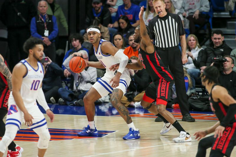Feb 19, 2023; Boise, Idaho, USA; Boise State Broncos guard Chibuzo Agbo (11) is guarded by UNLV Rebels guard EJ Harkless (55) during the first half at ExtraMile Arena. Mandatory Credit: Brian Losness-USA TODAY Sports

