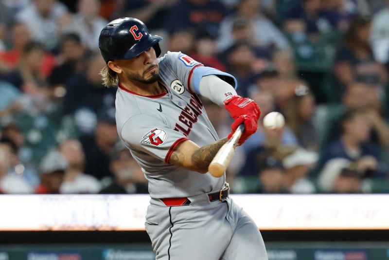 Sep 16, 2025; Detroit, Michigan, USA;  Cleveland Guardians shortstop Gabriel Arias (13) hits a home run in the fourth inning against the Detroit Tigers at Comerica Park. Mandatory Credit: Rick Osentoski-Imagn Images