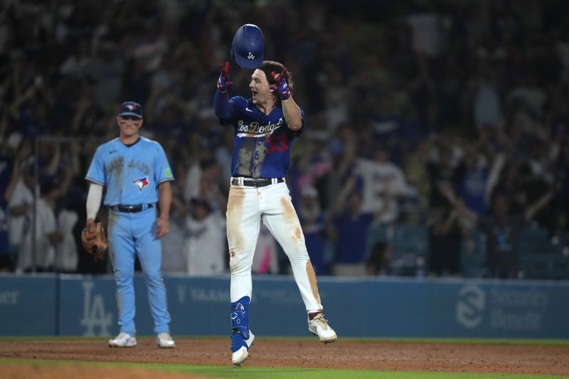 Jul 25, 2023; Los Angeles, California, USA; Los Angeles Dodgers center fielder James Outman (33) celebrates after hitting a walk-off double in the 10th inning against the Toronto Blue Jays at Dodger Stadium. Mandatory Credit: Kirby Lee-USA TODAY Sports