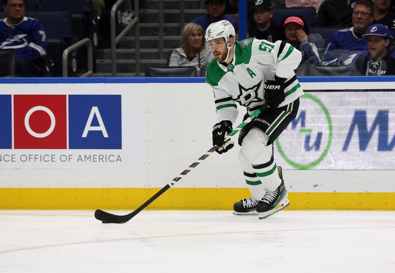 Oct 30, 2025; Tampa, Florida, USA; Dallas Stars center Tyler Seguin (91) skates with the puck during the second period at Benchmark International Arena. Mandatory Credit: Kim Klement Neitzel-Imagn Images
