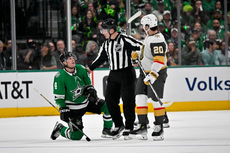 Apr 24, 2024; Dallas, Texas, USA; Dallas Stars defenseman Miro Heiskanen (4) and Vegas Golden Knights center Chandler Stephenson (20) are called for matching penalties in the first period in game two of the first round of the 2024 Stanley Cup Playoffs at American Airlines Center. Mandatory Credit: Jerome Miron-USA TODAY Sports