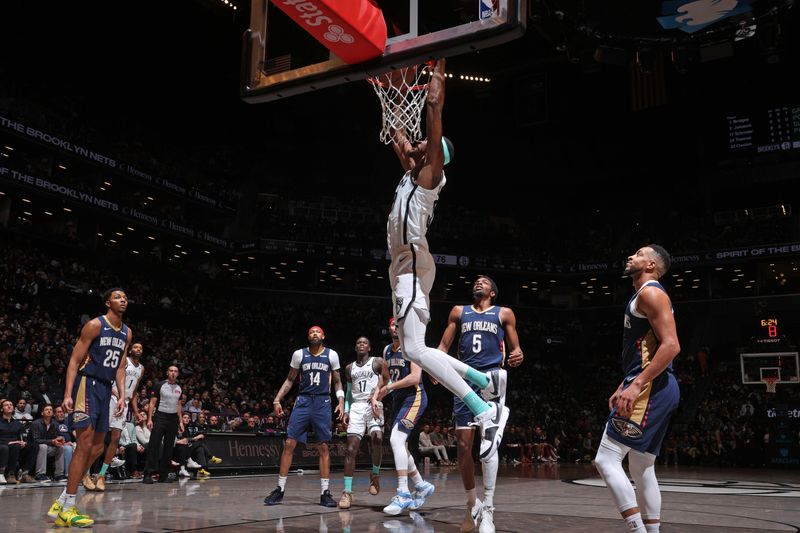 BROOKLYN, NY - MARCH 19: Nicolas Claxton #33 of the Brooklyn Nets dunks the ball during the game against the New Orleans Pelicans on March 19, 2024 at Barclays Center in Brooklyn, New York. NOTE TO USER: User expressly acknowledges and agrees that, by downloading and or using this Photograph, user is consenting to the terms and conditions of the Getty Images License Agreement. Mandatory Copyright Notice: Copyright 2024 NBAE (Photo by Nathaniel S. Butler/NBAE via Getty Images)