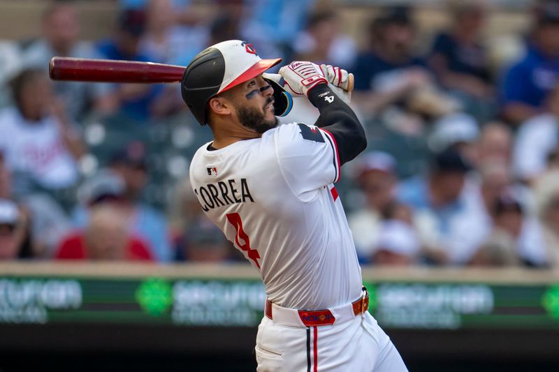 Jun 10, 2025; Minneapolis, Minnesota, USA; Minnesota Twins shortstop Carlos Correa (4) hits a double against the Texas Rangers in the fourth inning at Target Field. Mandatory Credit: Jesse Johnson-Imagn Images
