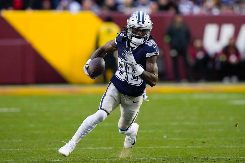 Dallas Cowboys wide receiver CeeDee Lamb (88) running with the ball against the Washington Commanders during the first half of an NFL football game, Sunday, Jan. 7, 2024, in Landover, Md. (AP Photo/Susan Walsh)