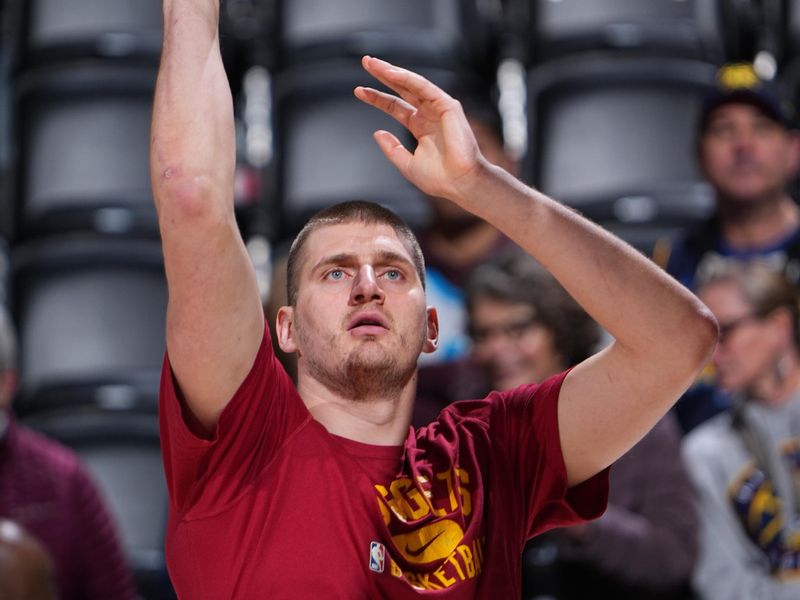 DENVER, CO - MARCH 25: Nikola Jokic #15 of the Denver Nuggets warms up before the game against the Memphis Grizzlies on March 25, 2024 at the Ball Arena in Denver, Colorado. NOTE TO USER: User expressly acknowledges and agrees that, by downloading and/or using this Photograph, user is consenting to the terms and conditions of the Getty Images License Agreement. Mandatory Copyright Notice: Copyright 2024 NBAE (Photo by Garrett Ellwood/NBAE via Getty Images)