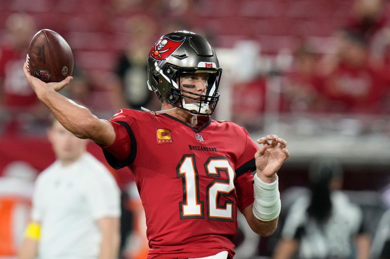 Tampa Bay Buccaneers quarterback Tom Brady (12) warms up before an NFL football game against the New Orleans Saints in Tampa, Fla., Monday, Dec. 5, 2022. (AP Photo/Chris O'Meara)