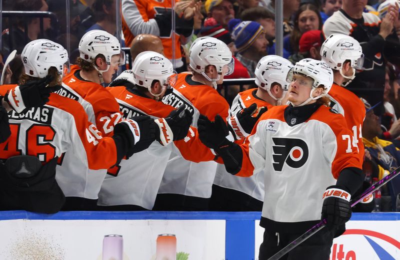 Jan 14, 2026; Buffalo, New York, USA;  Philadelphia Flyers right wing Owen Tippett (74) celebrates his goal with teammates during the second period against the Buffalo Sabres at KeyBank Center. Mandatory Credit: Timothy T. Ludwig-Imagn Images