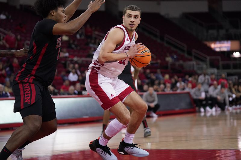 Feb 14, 2024; Fresno, California, USA; Fresno State Bulldogs guard Isaiah Pope (21) holds onto the ball next to UNLV Rebels forward Rob Whaley Jr. (5) in the second half at the Save Mart Center. Mandatory Credit: Cary Edmondson-USA TODAY Sports