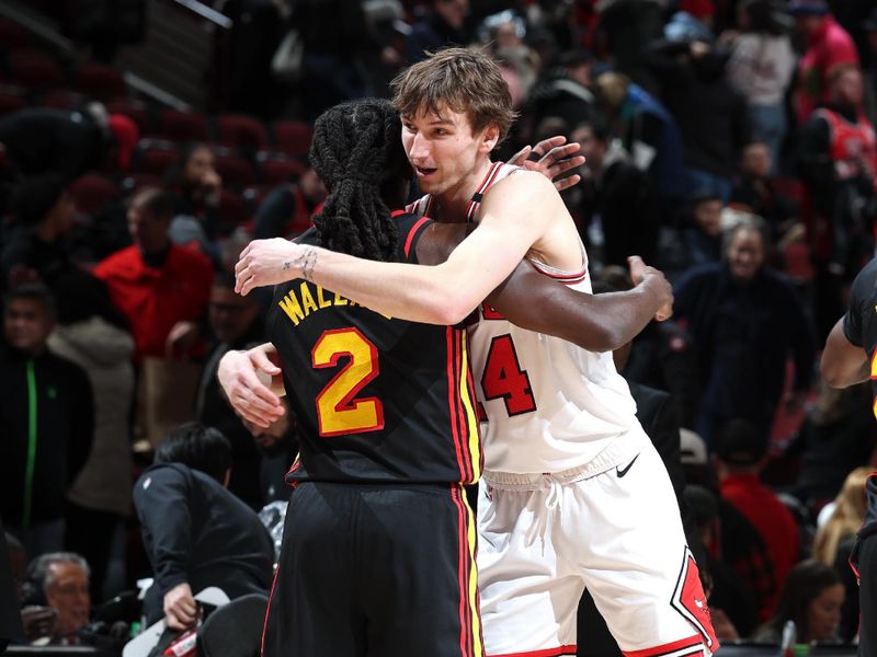 CHICAGO, IL - JANUARY 15: Matas Buzelis #14 of Chicago Bulls and Keaton Wallace #2 of the Atlanta Hawks embrace after the game on January 15, 2025 at United Center in Chicago, Illinois. NOTE TO USER: User expressly acknowledges and agrees that, by downloading and or using this photograph, User is consenting to the terms and conditions of the Getty Images License Agreement. Mandatory Copyright Notice: Copyright 2025 NBAE (Photo by Jeff Haynes/NBAE via Getty Images)