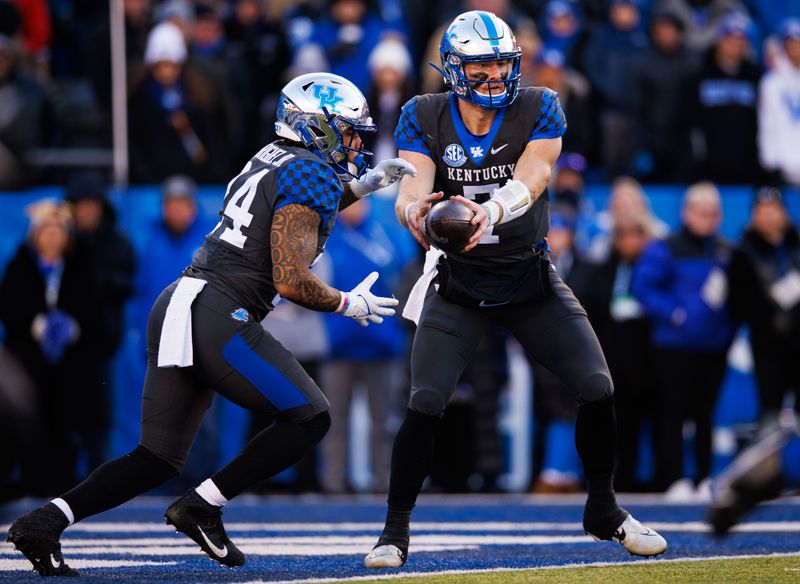 Nov 19, 2022; Lexington, Kentucky, USA; Kentucky Wildcats quarterback Will Levis (7) hands the ball off to running back Chris Rodriguez Jr. (24) during the first quarter against the Georgia Bulldogs at Kroger Field. Mandatory Credit: Jordan Prather-USA TODAY Sports