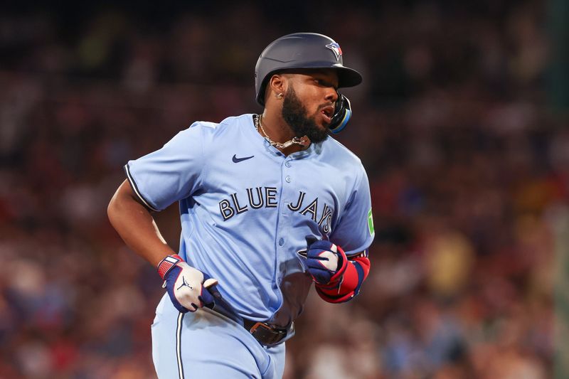 Jun 24, 2024; Boston, Massachusetts, USA; Toronto Blue Jays first baseman Vladimir Guerrero (27) rounds the bases after hitting a three run home run during the seventh inning against the Boston Red Sox at Fenway Park. Mandatory Credit: Paul Rutherford-USA TODAY Sports