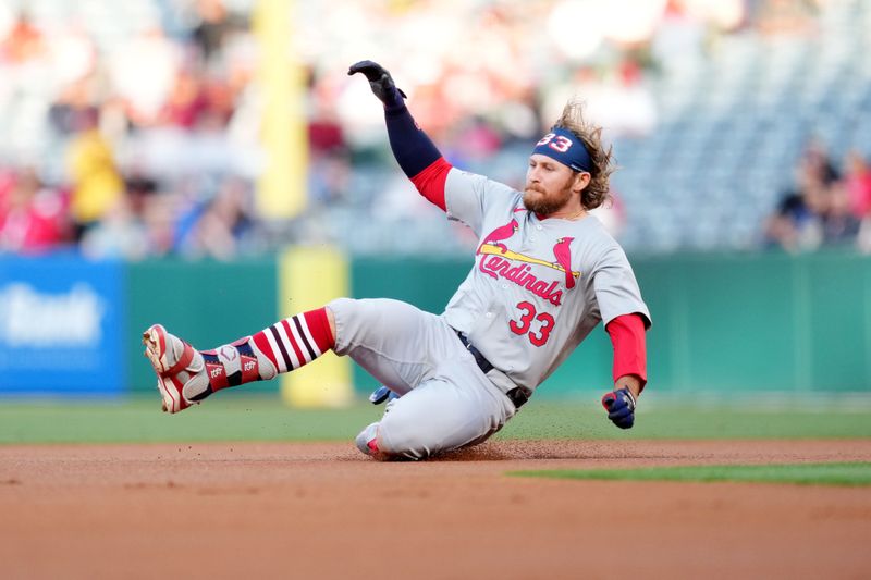 May 14, 2024; Anaheim, California, USA; St. Louis Cardinals left fielder Brendan Donovan (33) slides into second base in the first inning against the Los Angeles Angels at Angel Stadium. Mandatory Credit: Kirby Lee-USA TODAY Sports