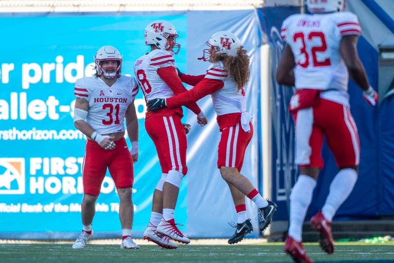 Dec 12, 2020; Memphis, Tennessee, USA;  Houston Cougars players celebrate during the first half against the Memphis Tigers at Liberty Bowl Memorial Stadium. Mandatory Credit: Justin Ford-USA TODAY Sports