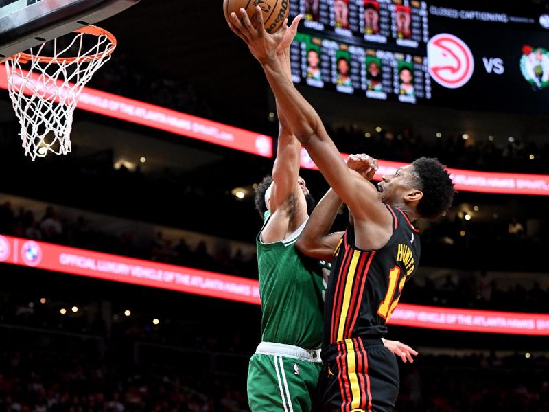 ATLANTA, GA - APRIL 21: De'Andre Hunter #12 of the Atlanta Hawks drives to the basket against the Boston Celtics during round one game three of the 2023 NBA Playoffs on April 21, 2023 at State Farm Arena in Atlanta, Georgia.  NOTE TO USER: User expressly acknowledges and agrees that, by downloading and/or using this Photograph, user is consenting to the terms and conditions of the Getty Images License Agreement. Mandatory Copyright Notice: Copyright 2023 NBAE (Photo by Adam Hagy/NBAE via Getty Images)