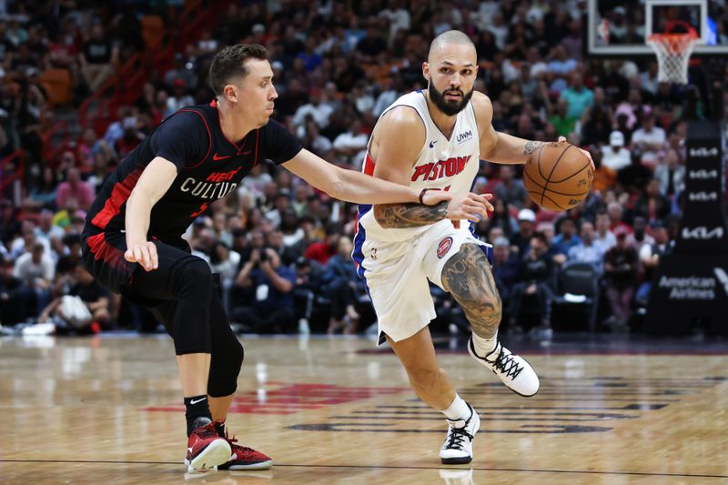 MIAMI, FLORIDA - MARCH 05: Evan Fournier #31 of the Detroit Pistons drives against Duncan Robinson #55 of the Miami Heat during the fourth quarter of the game at Kaseya Center on March 05, 2024 in Miami, Florida. NOTE TO USER: User expressly acknowledges and agrees that, by downloading and or using this photograph, User is consenting to the terms and conditions of the Getty Images License Agreement. (Photo by Megan Briggs/Getty Images)