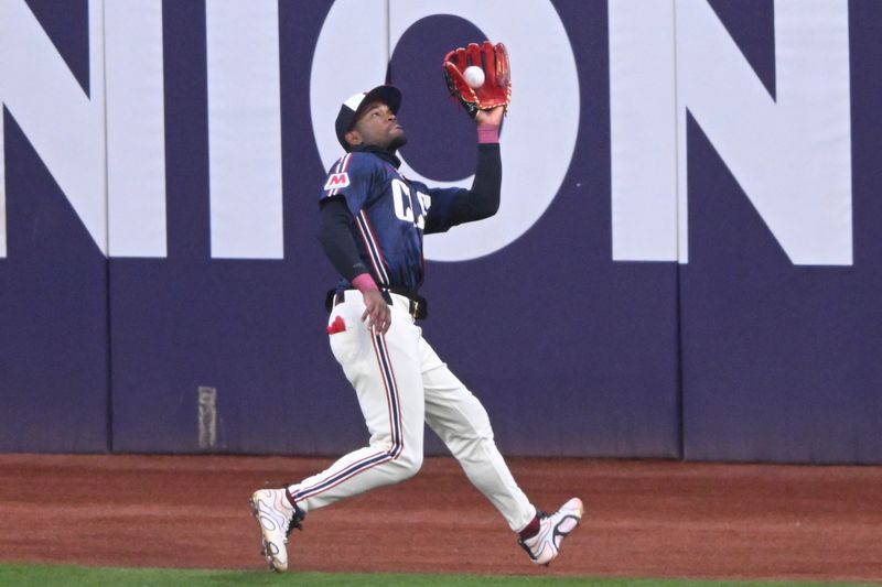 Apr 11, 2025; Cleveland, Ohio, USA; Cleveland Guardians center fielder Angel Martinez (1) makes a running catch in the fifth inning against the Kansas City Royals at Progressive Field. Mandatory Credit: David Richard-Imagn Images