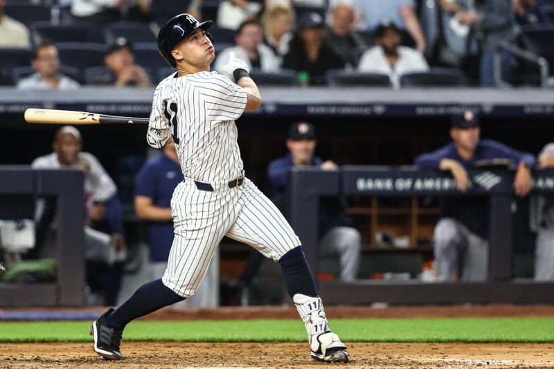 May 7, 2024; Bronx, New York, USA;  New York Yankees shortstop Anthony Volpe (11) hits a two run home run in the fourth inning against the Houston Astros at Yankee Stadium. Mandatory Credit: Wendell Cruz-USA TODAY Sports