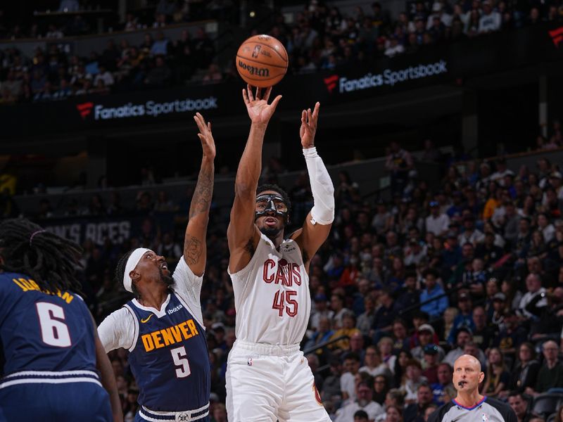 DENVER, CO - MARCH 31: Donovan Mitchell #45 of the Cleveland Cavaliers shoots a 3-point basket during the game  on March 31, 2024 at the Ball Arena in Denver, Colorado. NOTE TO USER: User expressly acknowledges and agrees that, by downloading and/or using this Photograph, user is consenting to the terms and conditions of the Getty Images License Agreement. Mandatory Copyright Notice: Copyright 2024 NBAE (Photo by Bart Young/NBAE via Getty Images)