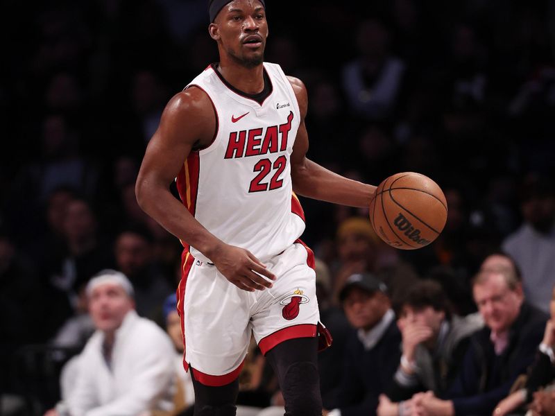 NEW YORK, NEW YORK - JANUARY 15:  Jimmy Butler #22 of the Miami Heat dibbles against the Brooklyn Nets during their game at Barclays Center on January 15, 2024 in New York City.   User expressly acknowledges and agrees that, by downloading and or using this photograph, User is consenting to the terms and conditions of the Getty Images License Agreement.  (Photo by Al Bello/Getty Images)