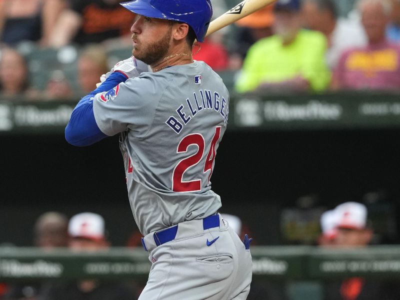 Jul 10, 2024; Baltimore, Maryland, USA; Chicago Cubs outfielder Cody Bellinger (24) singles in the third inning against the Baltimore Orioles at Oriole Park at Camden Yards. Mandatory Credit: Mitch Stringer-USA TODAY Sports