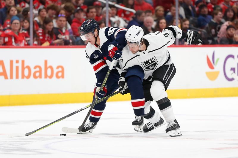 Jan 7, 2024; Washington, District of Columbia, USA; Washington Capitals right wing Nicolas Aube-Kubel (96) and Los Angeles Kings right wing Adrian Kempe (9) battle for the puck during the second period at Capital One Arena. Mandatory Credit: Amber Searls-USA TODAY Sports