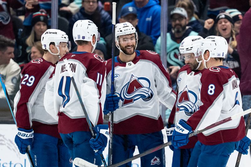 Mar 12, 2026; Seattle, Washington, USA; Colorado Avalanche, from left, forward Nathan MacKinnon (29), forward Brock Nelson (11), forward Nicolas Roy (10), forward Nazem Kadri (91) and defenseman Cale Makar (8) celebrate a goal during the first period against the Seattle Kraken at Climate Pledge Arena. Mandatory Credit: Stephen Brashear-Imagn Images
